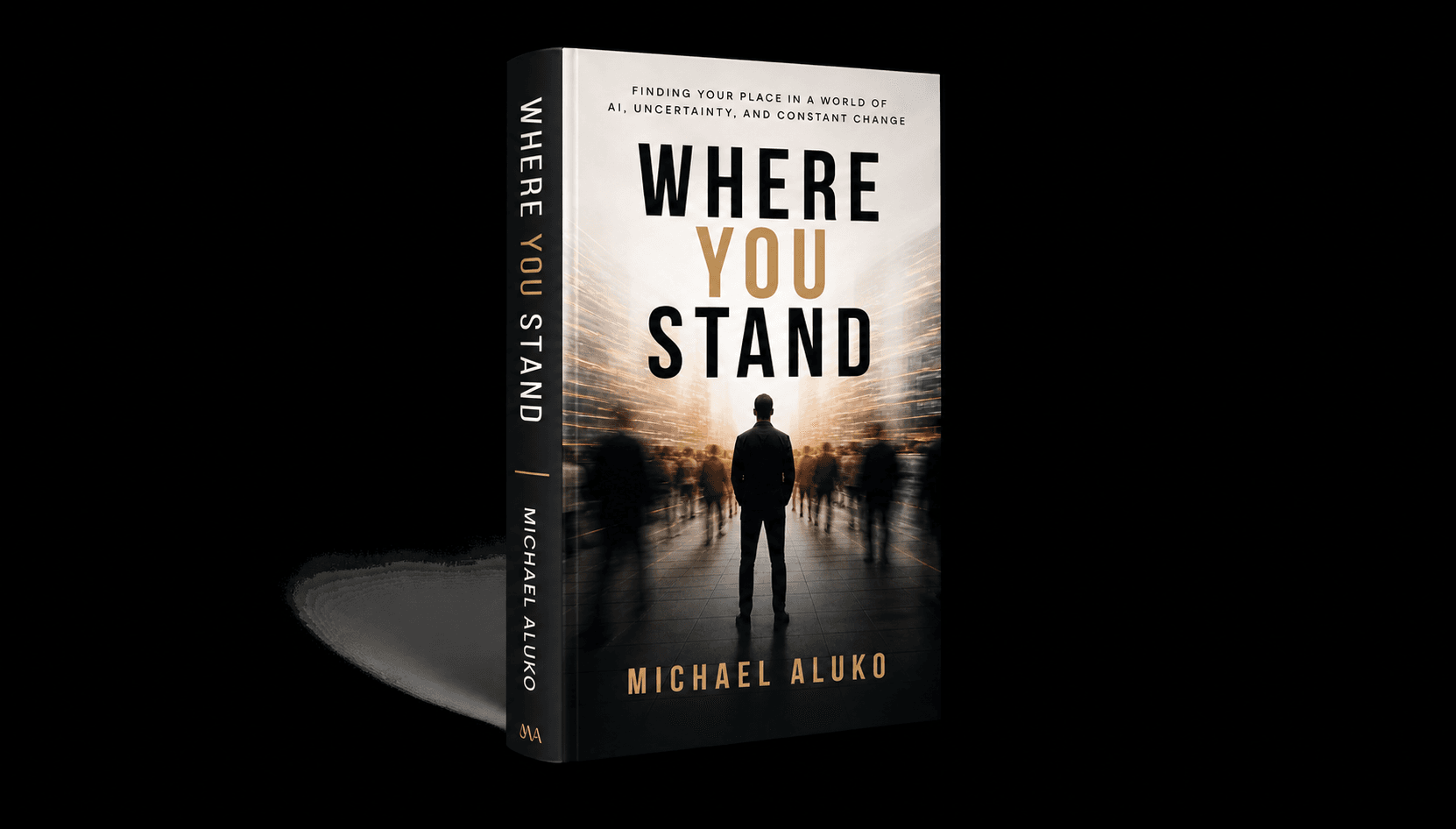 Michael B. Aluko standing with the book